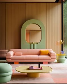 a living room with pink and green furniture