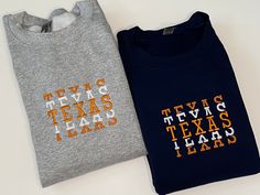 "Embroidered Sweatshirt | Texas Football Sweatshirt embroidered | UT Austin Sweatshirt | Football Sweatshirt | Austin TX Crewneck | University of Texas | Embroidered Texas Sweatshirt | TX College crewneck | Valentine's Day gift for Texas fan The Texas crewneck sweatshirt will make the perfect gift. Available in navy blue or gray. The sweatshirt is embroidered with the word \"TEXAS\" in a stacked font that includes a combination of a satin and faux stitch. The design measures approximately 5\"W x Fall College Embroidered T-shirt, Collegiate Embroidered Tops For College, Embroidered Text T-shirt For College In Fall, Varsity Style Embroidered Tops For College, Collegiate Embroidered Top For Game Day, College Crew T-shirt With Embroidered Text, College Team Spirit Embroidered Sweatshirt, Game Day Embroidered Crew Neck Top, Team Spirit Embroidered Cotton Sweatshirt