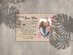 a wooden plaque with an image of two people kissing and the words to my best mom on it