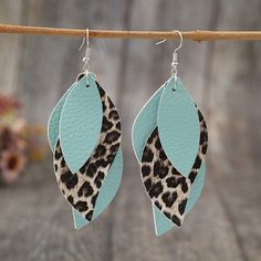 Get your hands on these stylish Leopard PU Leather Leaf Earrings, featuring one pair of Alloy and pu pieces. At 3.7 inches long and 0.2 ounces (7 grams) in weight, these earrings are the perfect addition to any outfit. Teal Leopard Print, Boutique Earrings, Leather Leaf Earrings, Apparel Boutique, Tiffany Earrings, Travel Size Beauty Products, Leather Leaf, Casual Earrings, Boutique Items