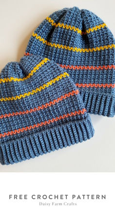 two blue knitted hats sitting next to each other