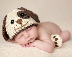 a baby is wearing a crocheted dog hat