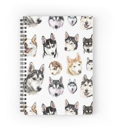 a spiral notebook with husky dogs all over the front and back cover, on a white background