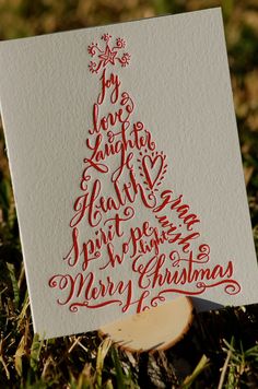 a christmas card with hand lettering on it