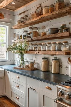 a kitchen filled with lots of open shelves