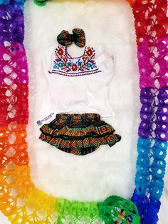 Ready to party??? Let's taco-bout it These Mexican Outfit set for baby girls are adorable. Completely handmade Embroidered Blouse ***Set includes*** Blouse Bloommer has ruffles on the back. Bow Embroidery colors will vary. Ready to ship in 1 day. We at Mexicanita Handmade truly appreciate your business, and we’re so grateful for the trust you’ve placed in us. We sincerely hope you are satisfied with your purchase if not please do not hesitate to reach out to us by e-mail mexicanitahandmade [!at] Bohemian Festive Ruffled Sets, Bohemian Ruffled Sets For Festive Occasions, Festive Bohemian Ruffled Sets, Bohemian Party Sets With Ruffles, Summer Multicolor Embroidered Sets, Multicolor Ruffled Sets For Festivals, Multicolor Bohemian Sets With Ruffles, Bohemian Multicolor Sets With Ruffles, Bohemian Multicolor Ruffled Sets