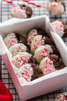 chocolate peppermint cookies with white and red sprinkles in a box