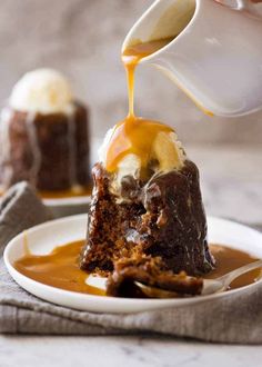 someone pouring caramel sauce on a piece of cake