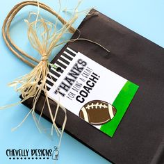 a black book with a football label on it and some twine around the cover