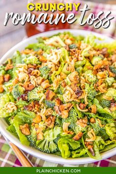 a white bowl filled with broccoli and nuts next to a jar of honey