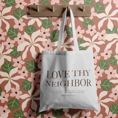 Introducing our "Love Thy Neighbor" Tote Bag – a powerful and uplifting accessory that spreads a message of love, faith, and positivity wherever you go. This beautifully designed tote bag is more than just a stylish accessory; it's a reminder of the unwavering love and grace that surrounds us, and the love we share with others. Our tote bag features a heartwarming and timeless design that incorporates the words "Love Thy Neighbor" from the Bible in a graceful and eye-catching font. The design is not only visually appealing but also serves as a gentle reminder of the profound love of Jesus. Inspirational Tote Bags For Everyday Use, Inspirational Letter Print Bags For Everyday Use, Daily Letter Print Rectangular Bag, Rectangular Bags With Letter Print, Love Thy Neighbor, Words Love, Love Your Neighbour, Love Messages, Stylish Accessories