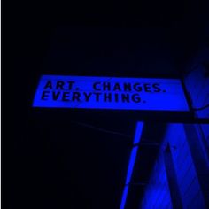 a street sign that reads art changes everything in blue light with the words art changes everything on it