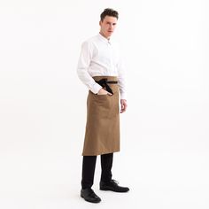 Expertly crafted in Chicago from a durable 7oz twill, this is a workhorse of a waist apron. Featuring dual hand pockets to store all of your serving needs, this apron will show up to work day in and day out. Features: Two Hand Pockets Material: 9oz 100% Cotton, Black Cotton Webbing Ties Fit: 31" Length Handmade in Chicago, USA Cotton Workwear Apron With Pockets, Bistro Apron, Custom Uniform, Chicago Usa, Waist Apron, Show Up, Two Hands, Brown Color, Black Cotton