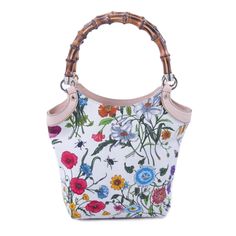 We the ity of this Gucci bag or your Full . The bag has been inspected and ated by our experts. Description: Gucci Floral Bamboo Bucket Bag Details: Beige Canvas with Multicolor Flower Prints / Gold-Tone Hardware / Dual Bamboo Handles / Beige Leather Trim / Natural Canvas Lining / Zipper Pocket and Flat Pocket at Inside / Open Top Includes Dustbag Measurement: Width 17cm / Height 24cm / Depth 9cm Condition: Pre/Loved in Good Condition. Some Stains on the Outside Leather Trim. Feel like trying before buying? Contact us on bagsarenaon@gmail.com or +1 307 216-5225 and we will arrange for same day viewing at our office. Bamboo Flower, Canvas Leather Tote Bag, Gucci Flora, Gucci Floral, Canvas Leather Tote, Bamboo Bag, Gucci Bamboo, Bamboo Handles, Canvas Handbags