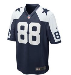 Support the Dallas Cowboys and celebrate this year's NFL Draft with the CeeDee Lamb #88 Nike Game Replica Throwback Jersey. Show your team spirit with this high quality replica jersey, featuring classic Cowboys style with solid-body construction and silicone graphics. The Nike Swoosh logos on the sleeves add the perfect finishing touch. Grab yours now! Nike Football Season Jersey, Nike Football Season Jersey With Team Name, Nike Jersey With Team Name For Football Season, Nike Football Season Jersey With Team Logo, Nike Team Jersey, College World Series, Nike Swoosh Logo, Football Gear, New Era Hats