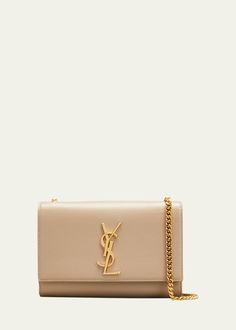 "Find SAINT LAURENT Kate Small Ysl Crossbody Bag In Grained Leather on Editorialist. Saint Laurent \"Monogram Kate\" shoulder bag in metal-free tanned grained calf leather Decorated with metal YSL initials and chain tassel Curb-chain shoulder strap with 22\" drop Flap top with tonal matte-finish logo medallion; magnetic snap closure Black hardware. Inside, organic cotton/leather lining; one slip pocket Bag weighs approx. 1.8 lb./ 0.8 kg 4.9\"H x 7.9\"W x 2\"D Made in Italy" Ysl Crossbody, Ysl Shoulder Bag, Ysl Crossbody Bag, Ysl Kate, So Kate, Leather Decor, The Saint, Chain Crossbody Bag, Dark Beige