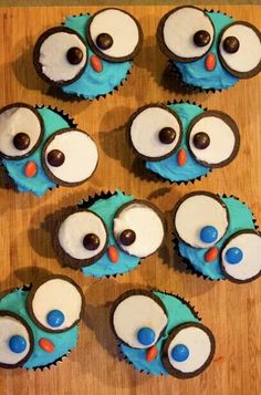 some cupcakes with blue frosting and eyes