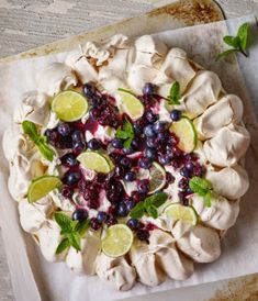 an uncooked pie with blueberries and limes