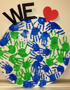 a paper plate with handprints on it and the words we love written in black