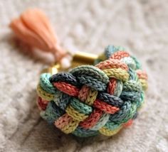 a multicolored ring with a tassel on it