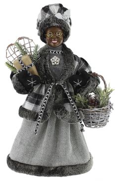 a figurine is holding a basket with pine cones and other items in it