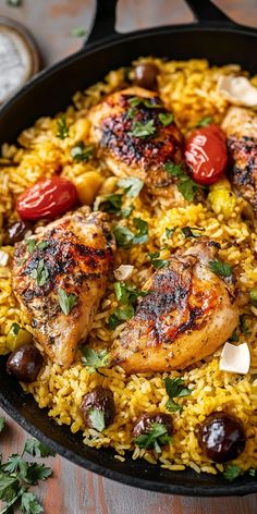 chicken and rice with tomatoes in a skillet