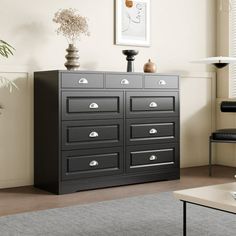 a living room with a large black dresser