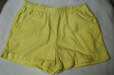 USA Standard Size: Girls XXL / 18 Brand: Wonder Nation Girls pale yellow lightweight woven shorts, soft feel, elastic waist, two front pockets, cuffed legs. Material: 65% cotton 35% rayon  One standard photo used to represent all sizes and may not match the size indicated in this listing. Pale Yellow, Casual Shorts, Elastic Waist, Cuff, Wonder, Womens Shorts, Elastic, Feelings, Yellow