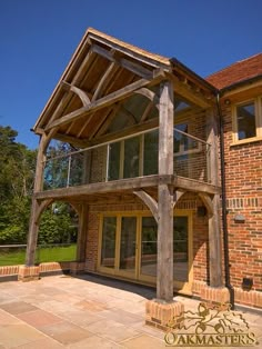 a large wooden structure sitting in front of a brick building