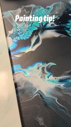 the back side of a surfboard with blue and white designs on it that says painting tips