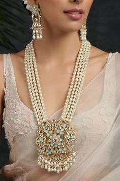 Turquoise Gold Plated Meenakari and Pearl Necklace. This regal Necklace Set is based on material of copper alloy. The four pearl strands end into a beautiful work of meenakari in an intricate floral pattern. the floral pattern is embellished with kundan and pearls ending into a waterfall of pearls. The piece is plated with 22k gold. This beauty is a must in your traditional jewelry collection. LENGTH Necklace Size - 26 inches. Closure - Adjustable Dori. Earring Size- 6 cm DETAILS -100% top Quali Turquoise Kundan Necklace With Meenakari Detailing, Traditional Turquoise Necklace With Meenakari, Traditional Turquoise Meenakari Necklace, Blue Necklace With Intricate Design For Festivals, Traditional Kundan Necklace In Turquoise, Turquoise Meenakari Jewelry For Gifts, Turquoise Meenakari Necklace For Wedding, Turquoise Traditional Jewelry With Intricate Design, Traditional Turquoise Jewelry With Intricate Design