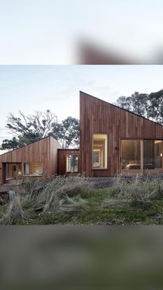 the house is made out of wood and has two windows on each side, along with sliding glass doors to let in natural light