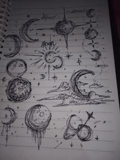 an open notebook with drawings on it and stars in the sky, planets and moon phases