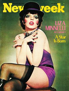 a magazine cover with a woman in stockings and heels on the cover, wearing a top hat