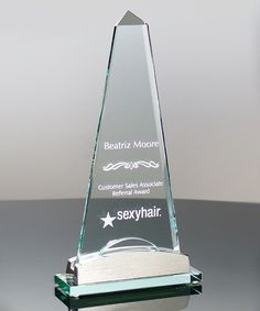 an award is placed on top of a black table with a white star in the center