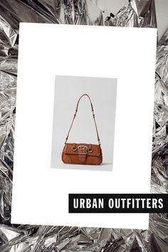 Seamed baguette bag in faux leather topped with chunky buckled detailing. Structured silhouette with an easy magnetic closure that opens to a fully lined interior with a zippered storage pocket. Finished with a hardware-topped shoulder strap. Exclusively at Urban Outfitters. Content + Care 100% PU Spot clean Imported Size Dimensions: 9.25" l x 1.75" d x 4.75" h Strap drop: 10.5" l | Urban Outfitters UO Jade Baguette Bag in Brown, Women's at Urban Outfitters Faux Leather Top, Baguette Bag, Hobo Bag, Baguette, Patch Pocket, Urban Outfitters, Jade, Sign Up, Faux Leather