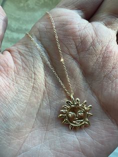 Our Gold Sun Necklace Talisman was created to be a protective force for you to wear and carry with you. This Gold Sun Pendant radiates life and energy with its intricately carved gold sun face pendant. This timeless sun charm shimmers with divine radiance and will be a source of positivity and a reminder to embrace the light within. Artisan-crafted from recycled solid 14k gold, made to order Hung from a 14k yellow gold 1mm chain measuring 18" long. Weighs approx. 3.5 grams We will be donating a Gold Sun Necklace, Talisman Pendant, Face Pendant, Sun Charm, Sun Face, Sun Necklace, Talisman Necklace, Sun Pendant, Leg Bag