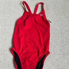 Nike Women's Red Swimsuit-One-Piece Size Casual Red Bodysuit For Pool, Casual Red Bodysuit For The Pool, Red One-piece Swimwear For Sports, Nike One-piece Sports Swimwear, Red One-piece Swimwear For Pool, Red One-piece Sport Swimwear, Red Moisture-wicking Sports Swimwear, Red Nylon Swimwear With Built-in Bra, Nike Swim