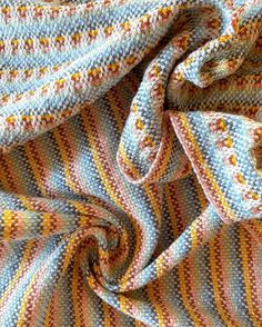 a close up view of a multicolored blanket