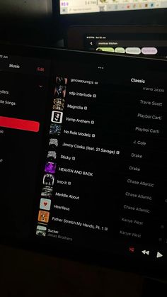 a computer screen with music on it's side and another monitor in the background