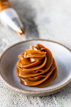 a white plate topped with lots of caramel sauce