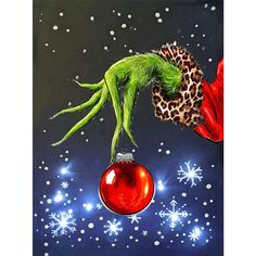 a painting of a green man hanging from a red ornament with snowflakes in the background