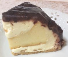 a piece of chocolate covered cheesecake on a plate