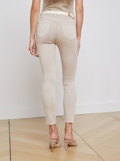 Our signature high-rise skinny jean crafted from premium, luxurious stretch denim in an oatmeal beige. Tapered leg hugs from hip to ankle, while the contoured waistband defines and slims the natural waist. High-recovery fabric holds its shape, smoothing the silhouette without sacrificing comfort. | L'AGENCE Margot Skinny Jean In Biscuit Jean Crafts, Fresh Cut, Tapered Legs, Stretch Denim, Oatmeal, High Rise, Blazer, Fabric