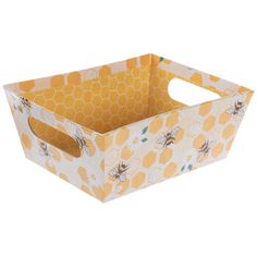 a yellow and white box with bees printed on the side, sitting in front of a white background