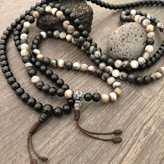 Beautiful black and mix Agate Japa Mala from Nepal. You can choose between the Black Agate mala and the Mix Agate mala necklace. A unique praying mala that can be used as a necklace or as an ornament. The mala has no clasp, you wear it over the head. The mala necklace is 42.5cm- 16.75 inch long A most have addition to your jewelry collect To see more unique Mala necklaces click the link below https://www.etsy.com/shop/AkashiJewelry?ref=seller-platform-mcnav&section_id=18307945 Enjoy Con salu Black Agate Beads With Natural Stones, Black Agate Gemstone Beads, Adjustable Agate Hand-strung Mala, Adjustable Hand-strung Agate Mala, Spiritual Black Natural Stone Beads, Agate Beaded Bracelets With 108 Beads For Meditation, Black Gemstone Beads Mala For Healing, Spiritual Agate Mala With Round Beads, Black Natural Stones Beads For Healing