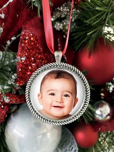 a christmas ornament with a baby's face on it