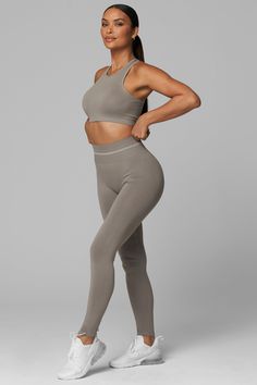 Introducing LiCi's True Form collection, a seamless activewear line that serves as a reminder to be true to yourself. Crafted with a fabric that feels silky smooth to the touch, and enhanced with a full interlocking knit construction, this collection offers the perfect combination of compression and breathability. Full Coverage Jewel Neckline With Removable Pads Racer Back 2-Tier Ribbed Under Band Detail With Multi-Support Compression Levels LiCi Logo placement center back Fabric: Seamless 90% N Solid Stretch Seamless Activewear, Seamless Stretch Solid Activewear, Solid Stretch Activewear With Seamless Construction, Solid Color Stretch Seamless Activewear, Solid Color Seamless Stretch Activewear, Seamless 4-way Stretch Activewear Sportswear, Seamless 4-way Stretch Sportswear Activewear, Solid Color Activewear With Seamless 4-way Stretch, Versatile Solid Activewear With Seamless Construction