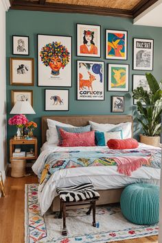 a bedroom with pictures on the wall above the bed