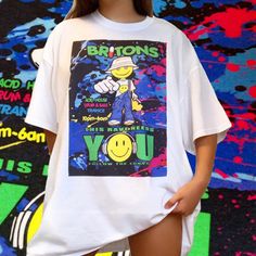 🍄 Our Britons Rave Graphic Tee 🍄  Take a step into festival culture with this sick hand drawn graphic design by Mikiko! 👁 FREE WORLDWIDE SHIPPING 👁 Unisex t-shirts available in sizes  - Small - Medium - Large - XL - XXL (other sizes can be made upon request) - Ethically and sustainably manufactured - Artwork is professionally printed - no cracks or peeling - High quality heavy tee with a taped neck and sleeves - Authentic artwork - Machine wash inside out for best results (Hand-wash works ev T Shirt Rave Outfit, Trippy Smiley Face, Acid House, Rave Outfit, Smiley Faces, Oversize Fashion, Rave Outfits, Retro Prints, Handmade Clothes